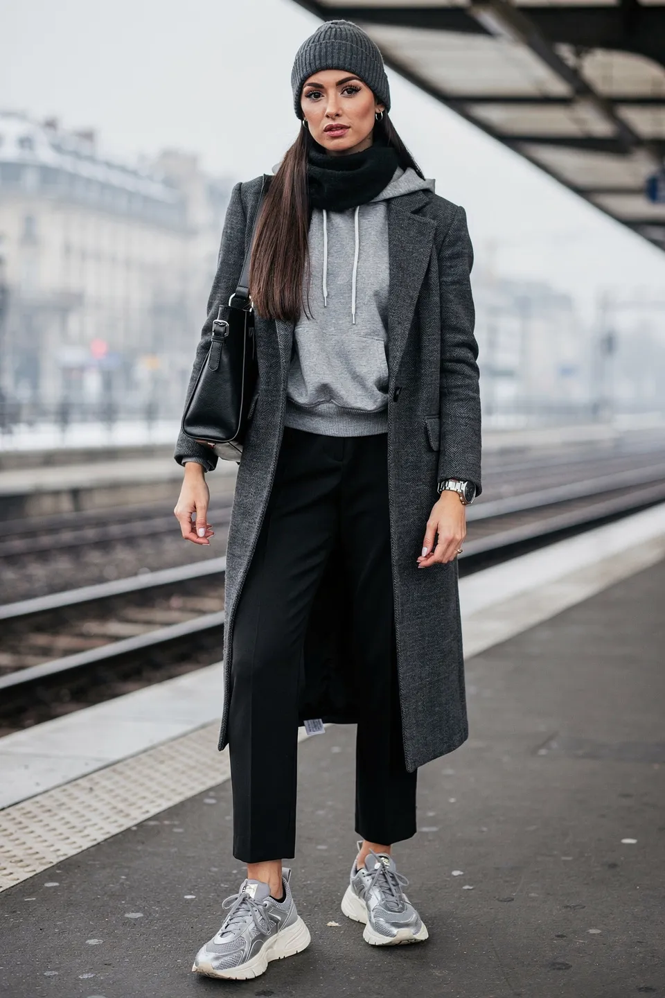 Charcoal Wool Coat with Grey Hoodie, Black Trousers and Silver Sneakers Charcoal Wool Coat with Grey Hoodie, Black Trousers and Silver Sneakers